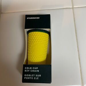 Starbucks yellow/green studded Hawaiian keychain. NWT